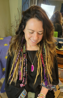 Client wearing handmade fabric dread wraps mixed into natural locs. A custom, eco-friendly alternative or accent to synthetic dread extensions.